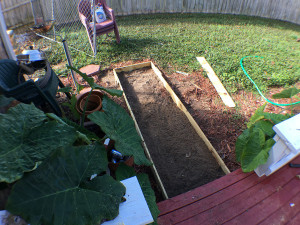 Wood form setup for the small sidewalk pad near the grill area