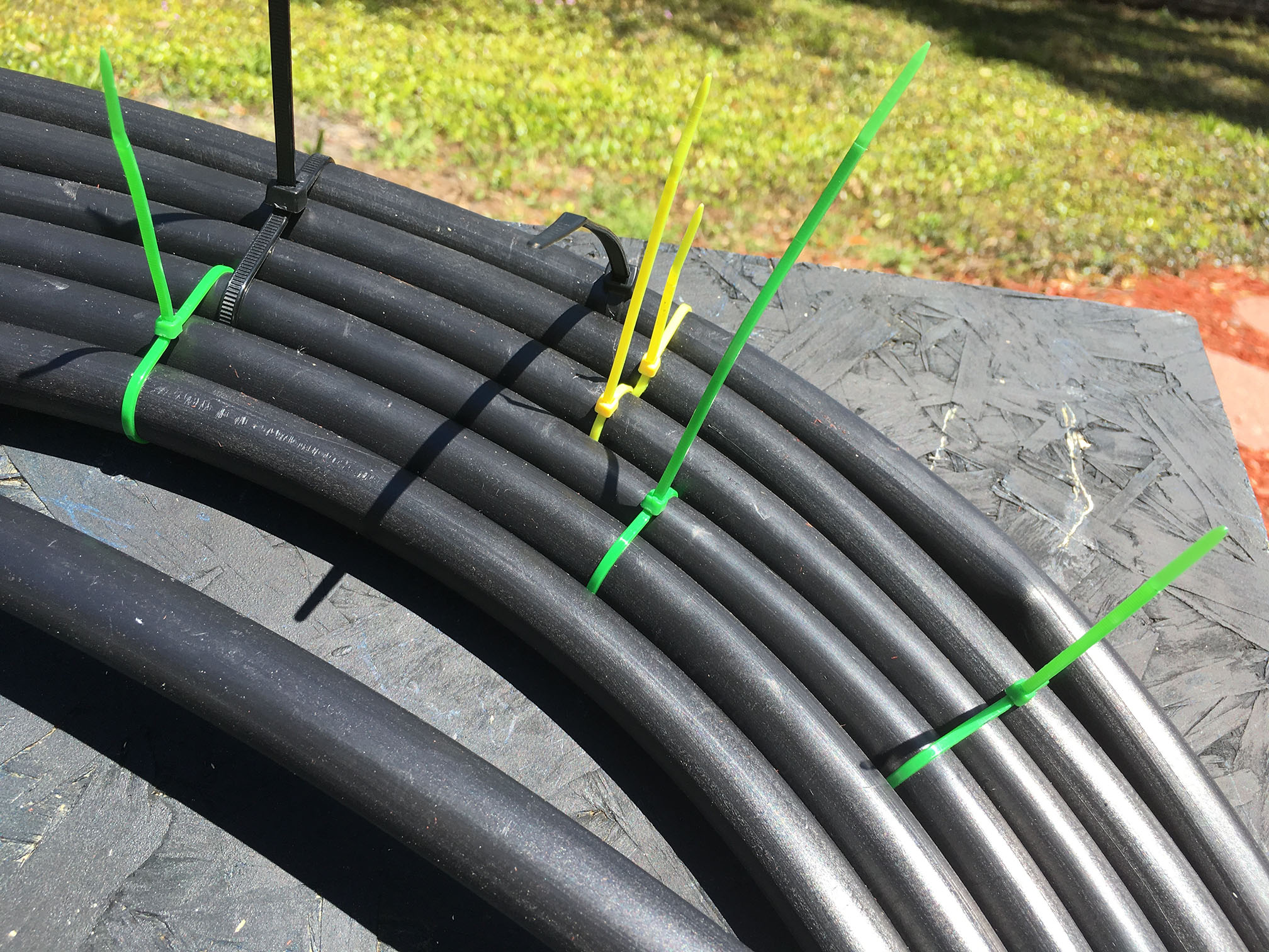 Plywood panel with early coil layout before final tie-down spacing