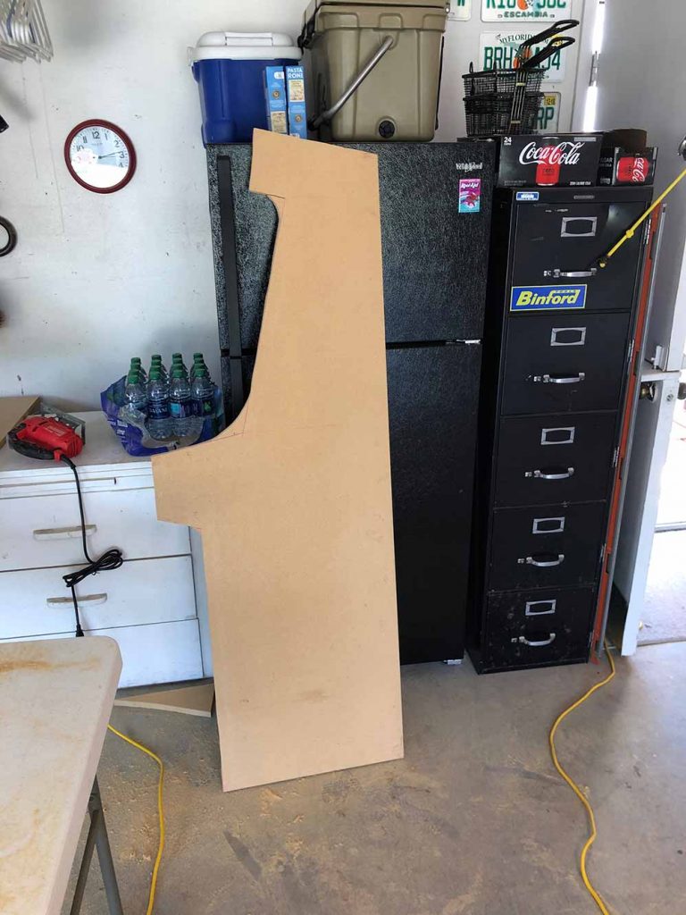 Cabinet body assembly in progress with unfinished wood panels