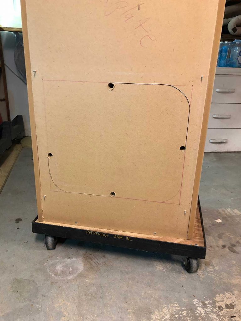 Rear service opening showing PC access area in the cabinet